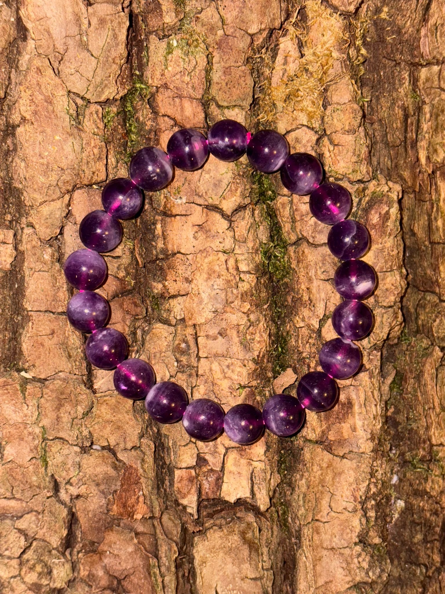 Bracelet boule fluorine violette rubanée